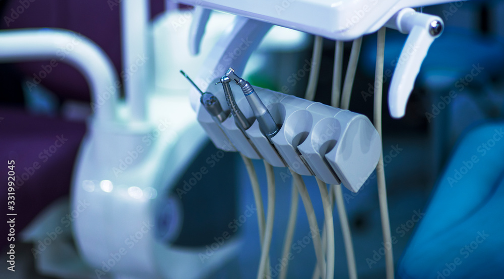 dentist's instruments with shallow depth of field blue tinted dentist's instruments with shallow depth of field blue tinted