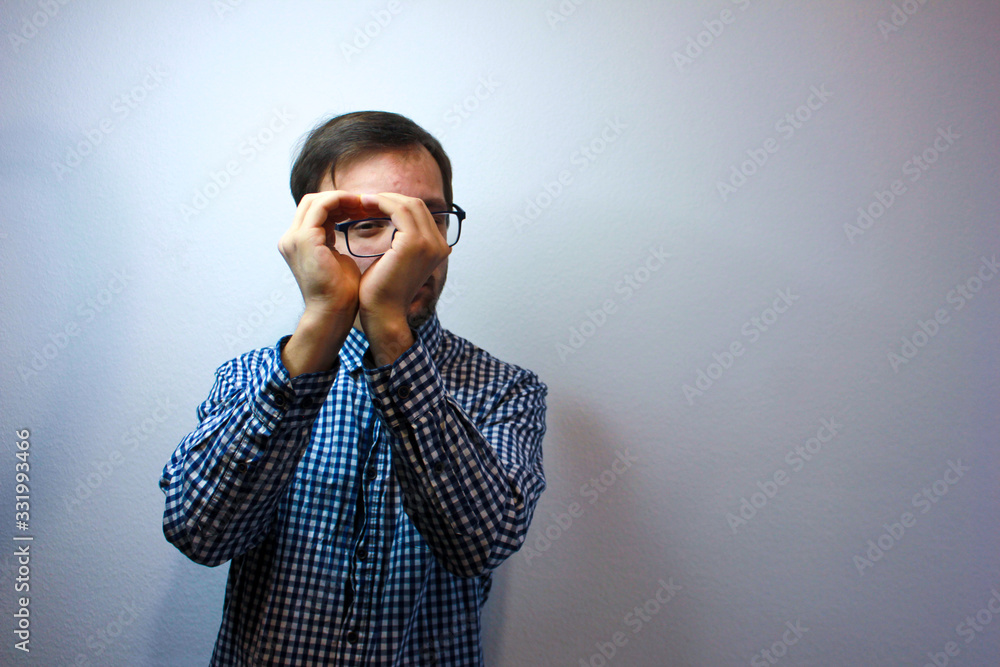 Headshot portrait of caucasian young man wearing a plaid shirt isolated on grey background show heart gesture with hands, smiling millennial male guy look at camera send love, charity concept Headshot portrait of caucasian young man wearing a plaid shirt isolated on grey background show heart gesture with hands, smiling millennial male guy look at camera send love, charity concept