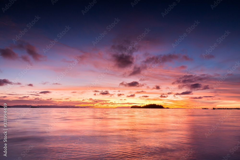 Beautiful sunrise sky over tropical sea in Thailand