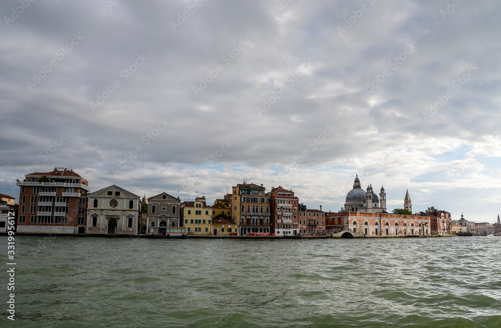 Beautiful view to Venice from the sea boat. Italy, Europe. Traditional italian architecture full of historical buildings and bridges 