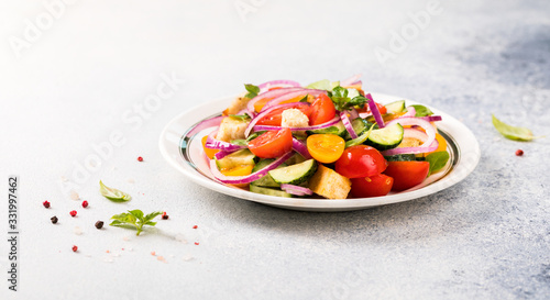 Vegetable salad. Panzanella traditional food of Italy with tomatoes and bread.