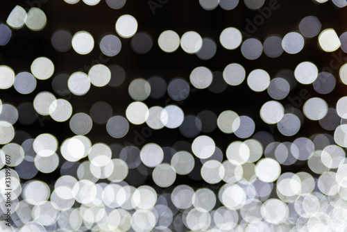 Christmas background. Festive abstract background with bokeh defocused lights and stars