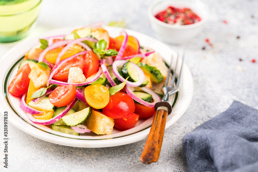 Vegetable salad. Panzanella traditional food of Italy with tomatoes and bread.