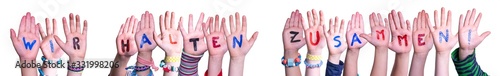 Children Hands Building Colorful German Word Wir Halten Zusammen Means Together We Are Stron. White Isolated Background photo