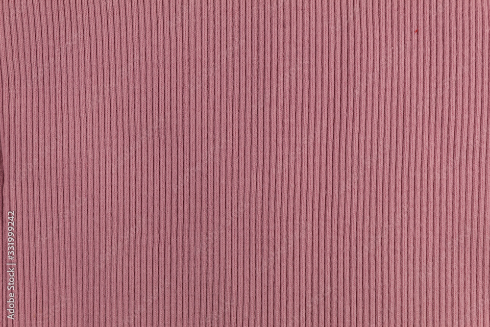 Background. Texture. Pink knitted fabric with pronounced stripes. Background. Texture. Pink knitted fabric with pronounced stripes.