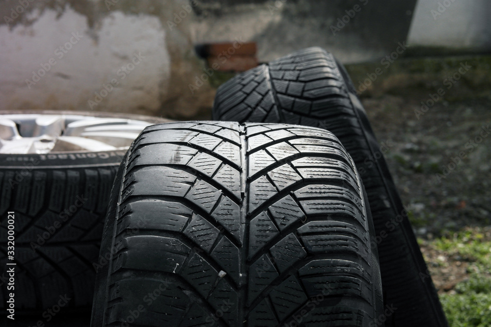 Obraz premium a lot of car black tires with different tyre tread stack together in a group. 