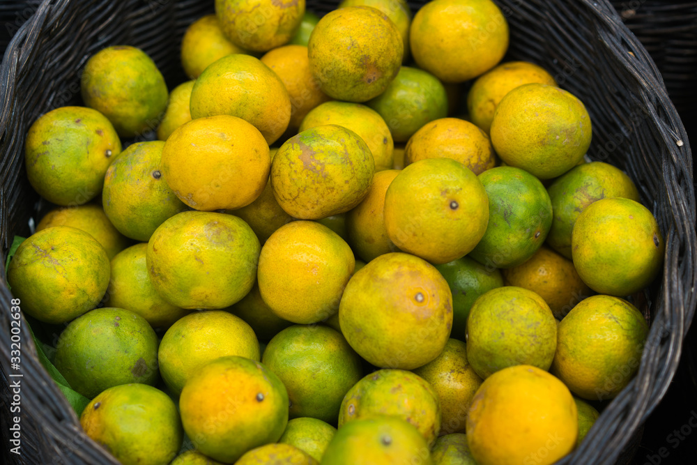 Orange fruit in fresh market background.