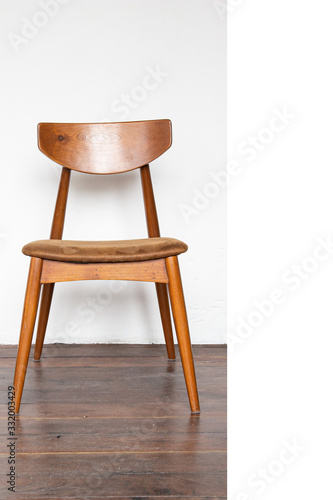 Vintage wooden chair on on wooden parquet floor.