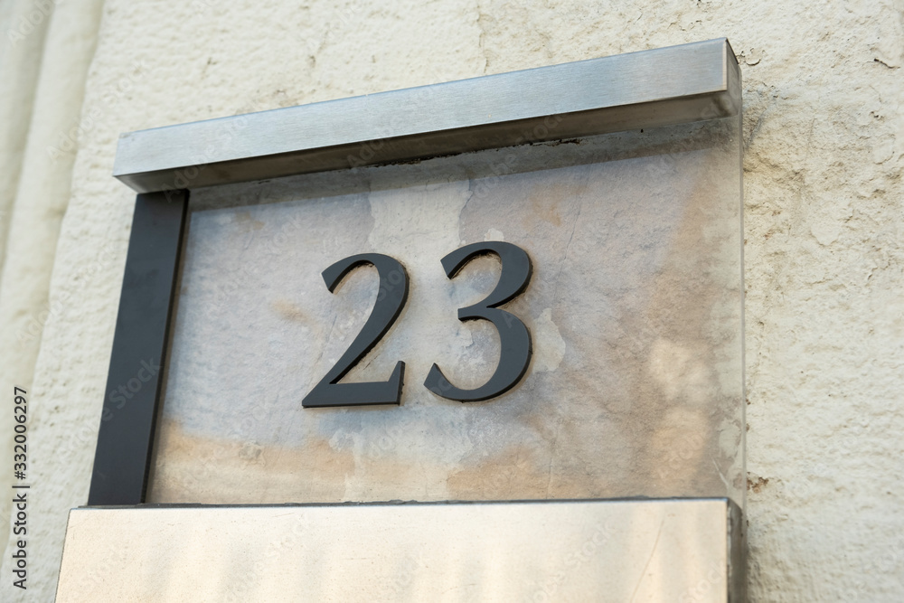 Twenty three (23) door number on the wall. Twenty three (23) door number on the wall.