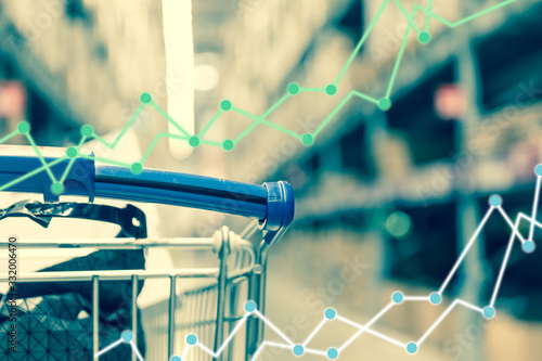 Business trading graph on shopping cart background