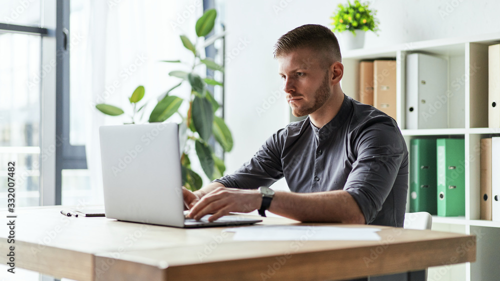 Side view of concentrated at work confident young woman Side view of concentrated at work confident young woman