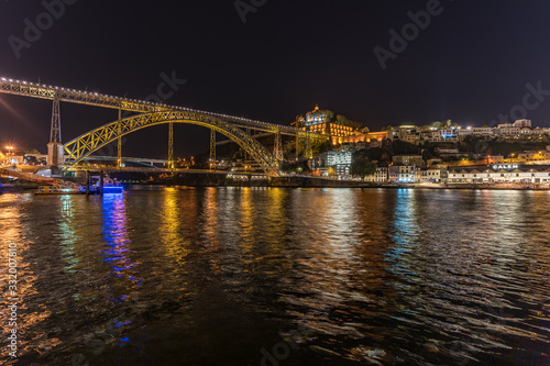 Porto with the monastery da serra do pilar and Luis I bridge during night, Portugal © Kizaru