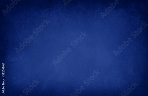 dark blue background with black border texture, old solid blue paper that is blank for websites and product display mockups or studio backgrounds, abstract faint marbled mottled design