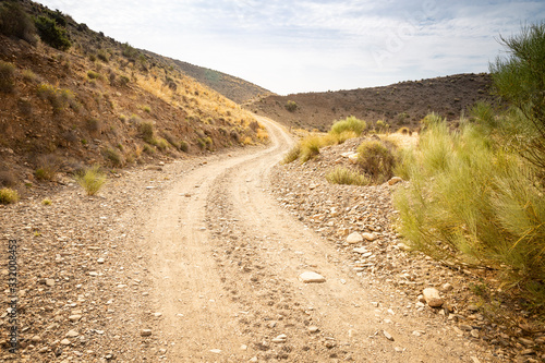 a gravel mountain road next to Rambla de Gergal (Santa Fe de Mondujar), Almeria, Andalusia, Spain 