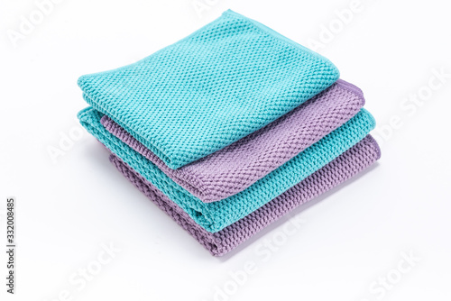 stack of colorful towels isolated on white background