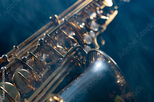 Photography Golden shiny alto saxophone on black background with smoke