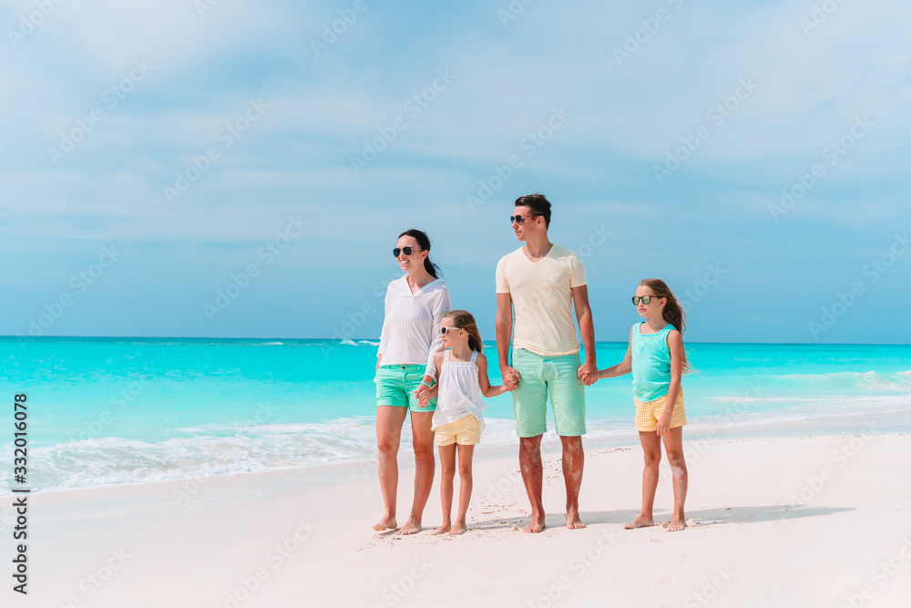 Young family with two kids on beach vacation