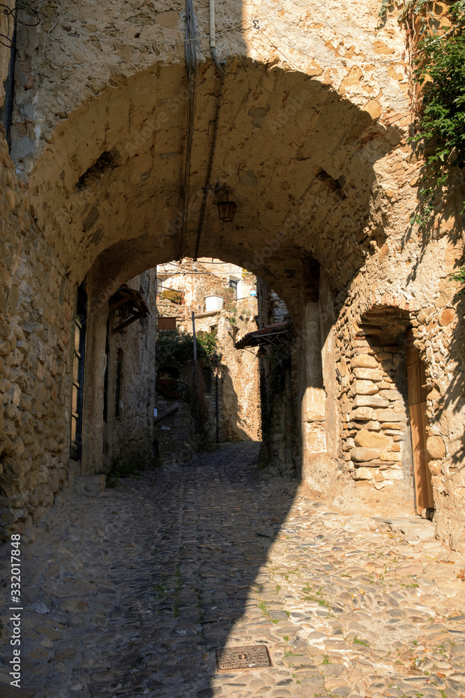 Bussana Vecchia (IM), Italy - December 12, 2017: A typical house and pathway in Bussana Vecchia, Imperia, Liguria, Italy