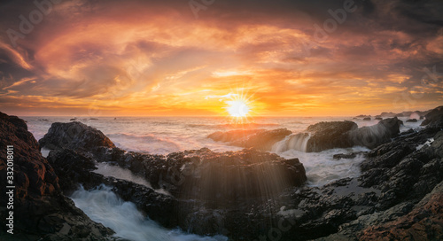 Golden sunset and splashes at Beluga rock