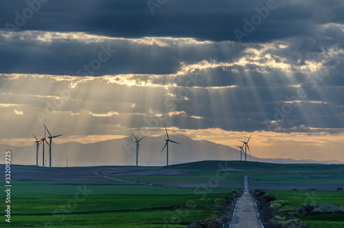 Campo de los Monegros de Aragón con turbinas eólicas al atardecer (Aragón, España) photo