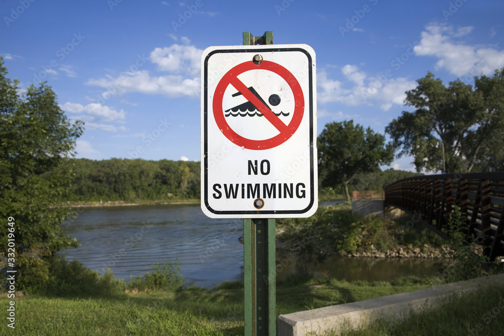 Warning sign that reads No Swimming along Iowa River, Nebraska