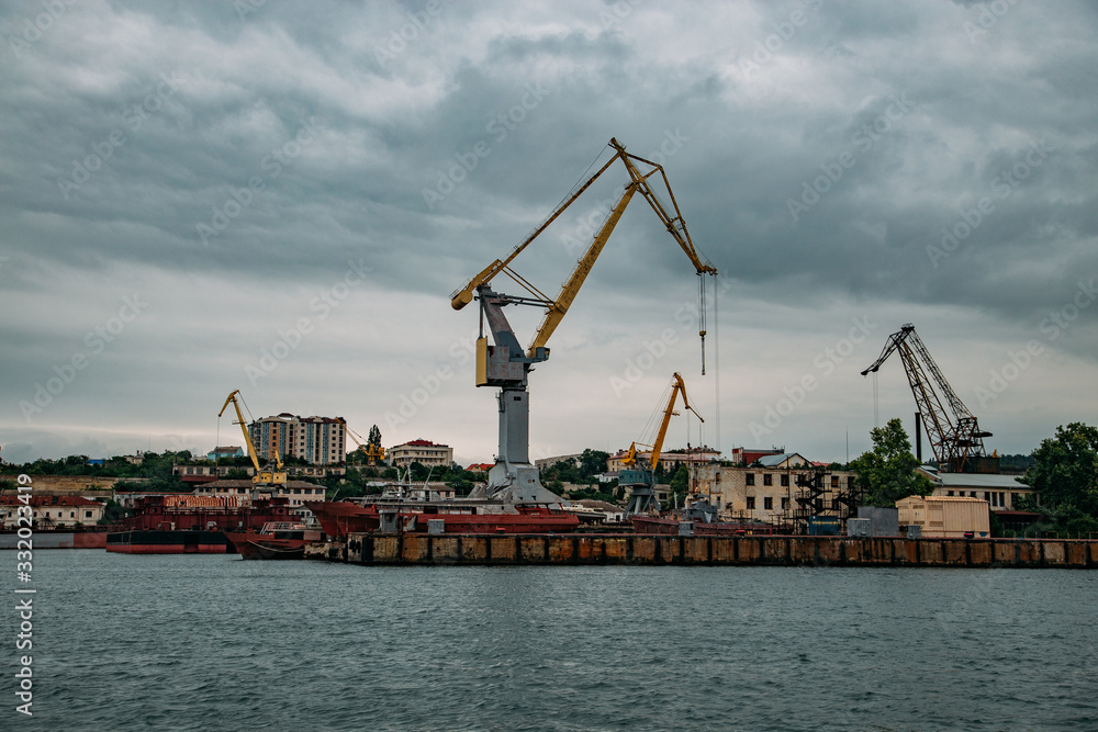 Shipyard. Sea port with cranes and dry dock for ship repair