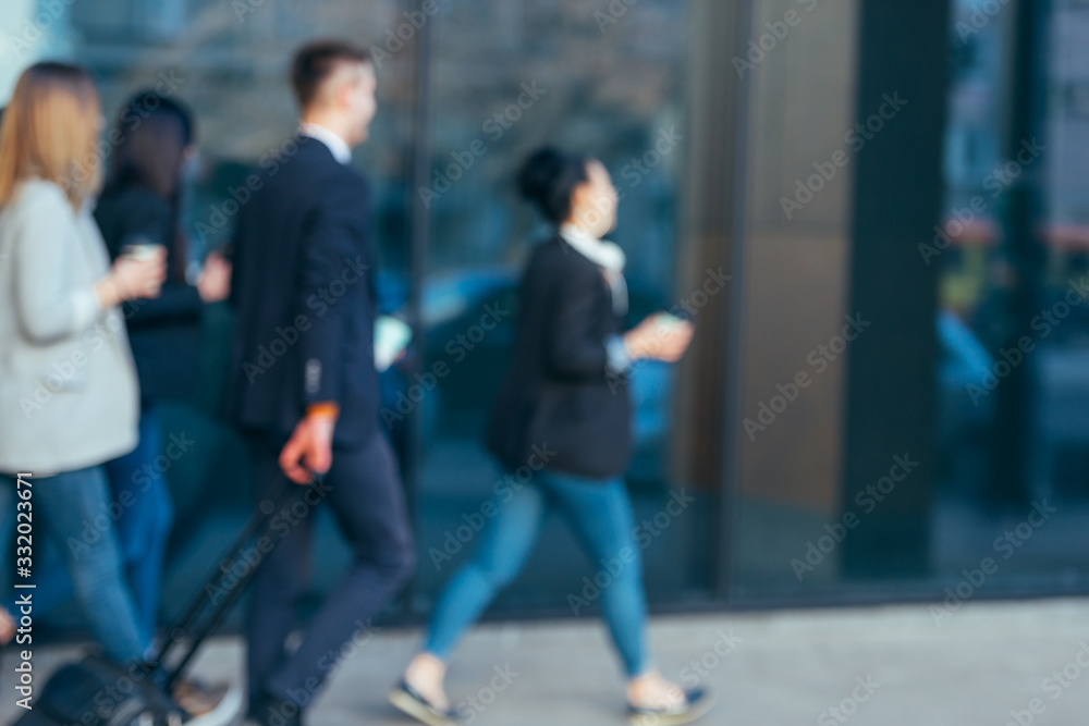 Group of colleagues on a business trip (euro trip) walking together at a modern futuristic station Group of colleagues on a business trip (euro trip) walking together at a modern futuristic station