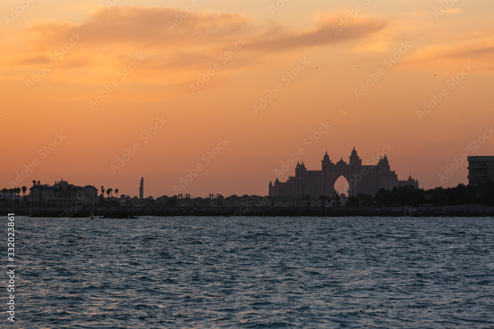 silhouette of the building on the sea shore sunset