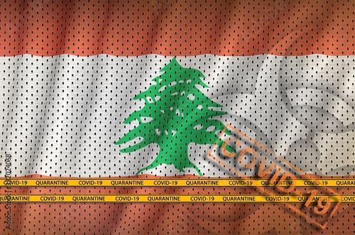 Lebanon flag and orange Covid-19 stamp with border tape. Coronavirus or 2019-nCov virus concept photo