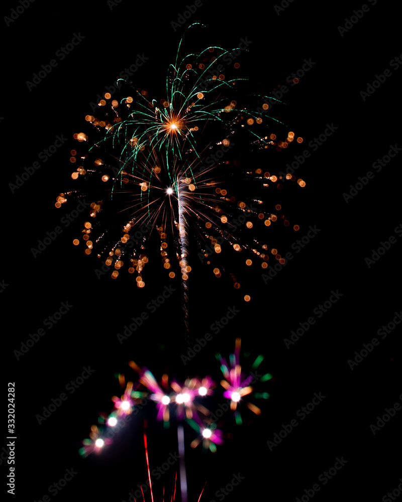 Fototapeta premium New Years or 4th of July Fireworks in a Night Sky
