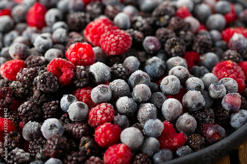 frozen raspberries, blackberries and blueberries close up