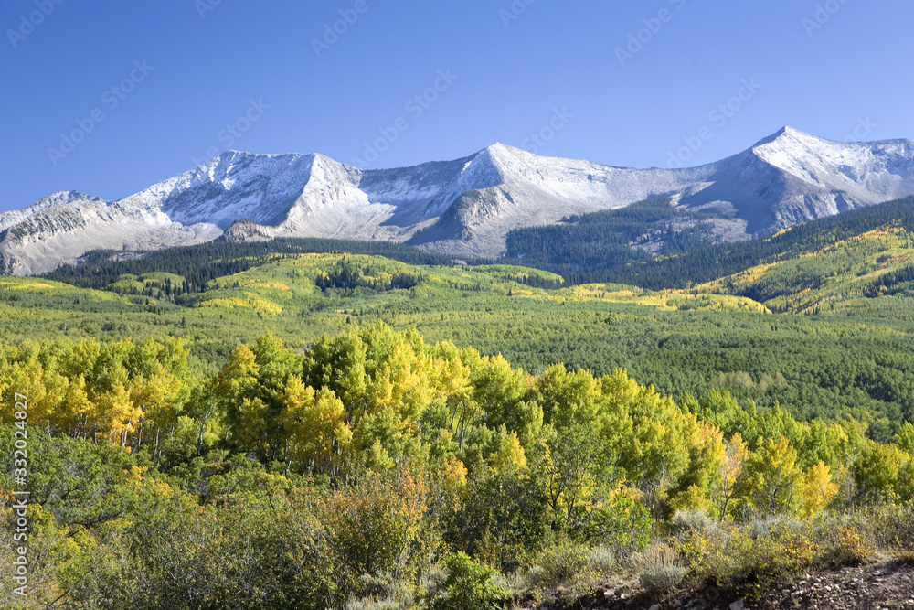 Snow capped mountains with autumn color off Route 62 west of Ridgeway toward Telluride, Colorado Snow capped mountains with autumn color off Route 62 west of Ridgeway toward Telluride, Colorado