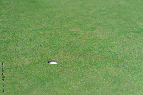 Golf hole with green grass