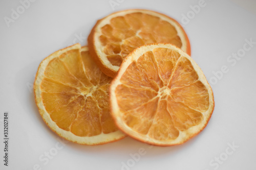 Slice of orange close up on white background