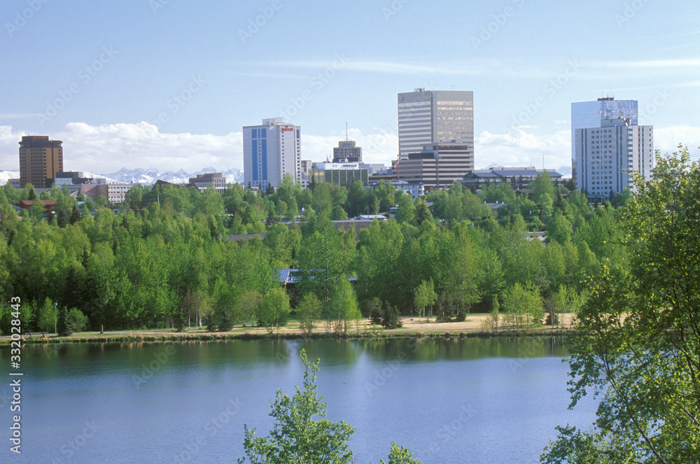 Skyline of Anchorage with Lake Spenard in the foreground and Mt. Hood in the back