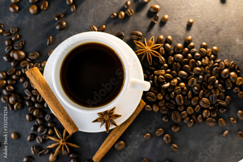 Coffee with beans on dark background