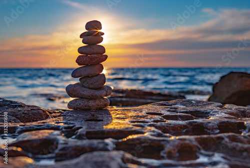 Zen concept. Sunset. The object of the stones on the beach at sunset.  Relax   Meditation. Zen stones