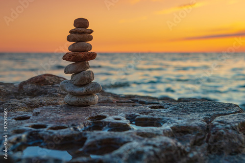 Zen concept. Sunset. The object of the stones on the beach at sunset.  Relax & Meditation. Zen stones