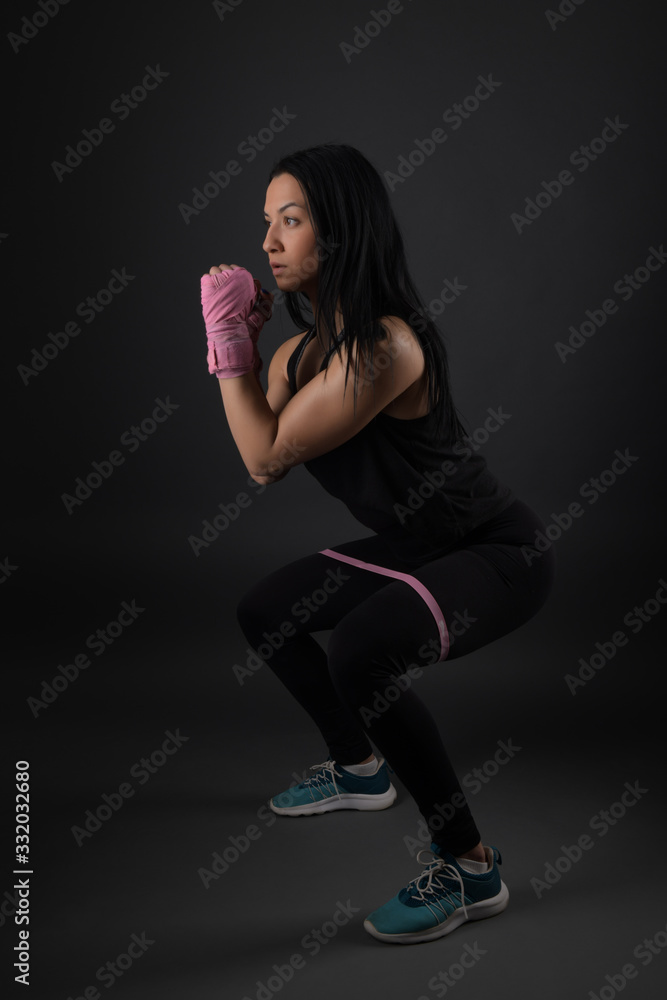 Woman boxer training hard.