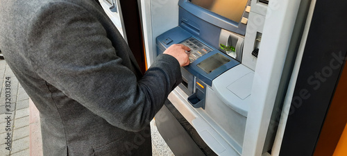 man using a atm machine