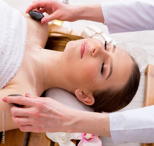 Young woman during spa procedure in salon