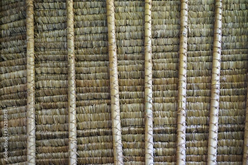 Underside of a traditional palm thatched roof in Bali Indonesia