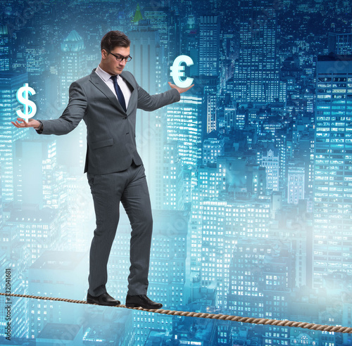 Businessman balancing between choosing dollar and euro