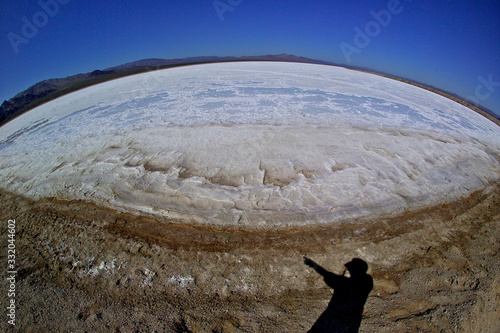 Fisheye panorama of salt evaporation lake and shadow of photographer, Bristol Lake, California   photo