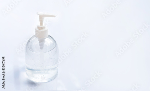 Alcohol hand sanitizer gel in pump bottles for hand hygiene corona virus (Covid-19) protection. Over bright background