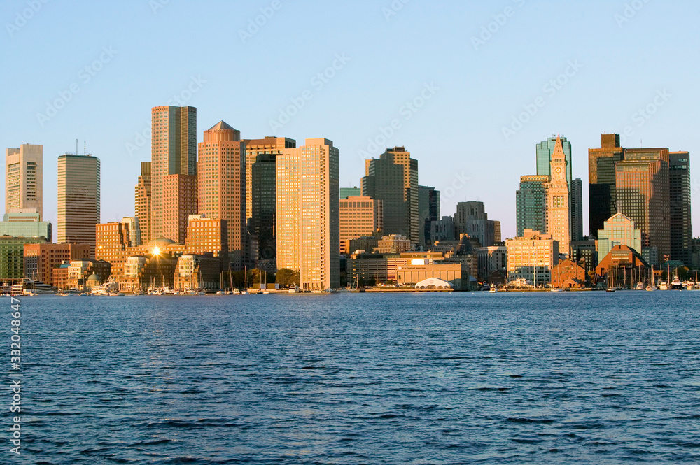Boston Harbor and the Boston skyline at sunrise as seen from South Boston, Massachusetts, New England Boston Harbor and the Boston skyline at sunrise as seen from South Boston, Massachusetts, New England