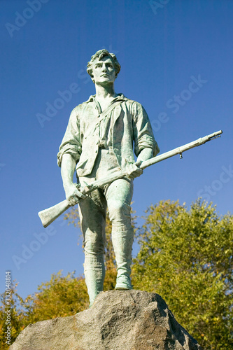 Minuteman soldier from Revolutionary War greets visitors to Historical Lexington, Massachusetts, New England photo