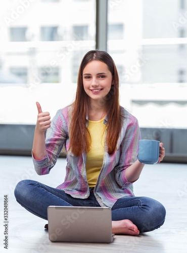 Free Download Young girl surfing internet on laptop - GFXLoad