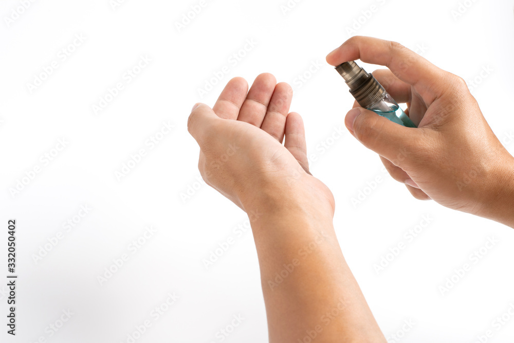 Man hands applying alcohol sanitizer spray or anti bacteria spray to another hand for prevent spread of virus, bacteria and germs. COVID-19 Pandemic Coronavirus prevention and personal hygiene concept Man hands applying alcohol sanitizer spray or anti bacteria spray to another hand for prevent spread of virus, bacteria and germs. COVID-19 Pandemic Coronavirus prevention and personal hygiene concept