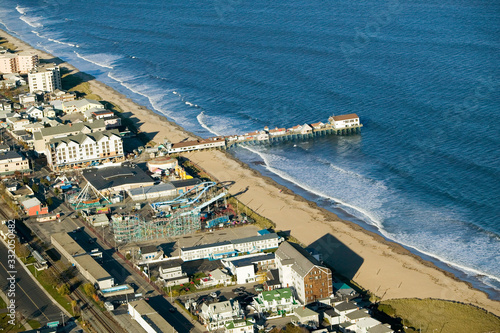 Aerial view of Old Orchard Beach downtown, pier, new hotel and amusement park on Maine Coastline south of Portland